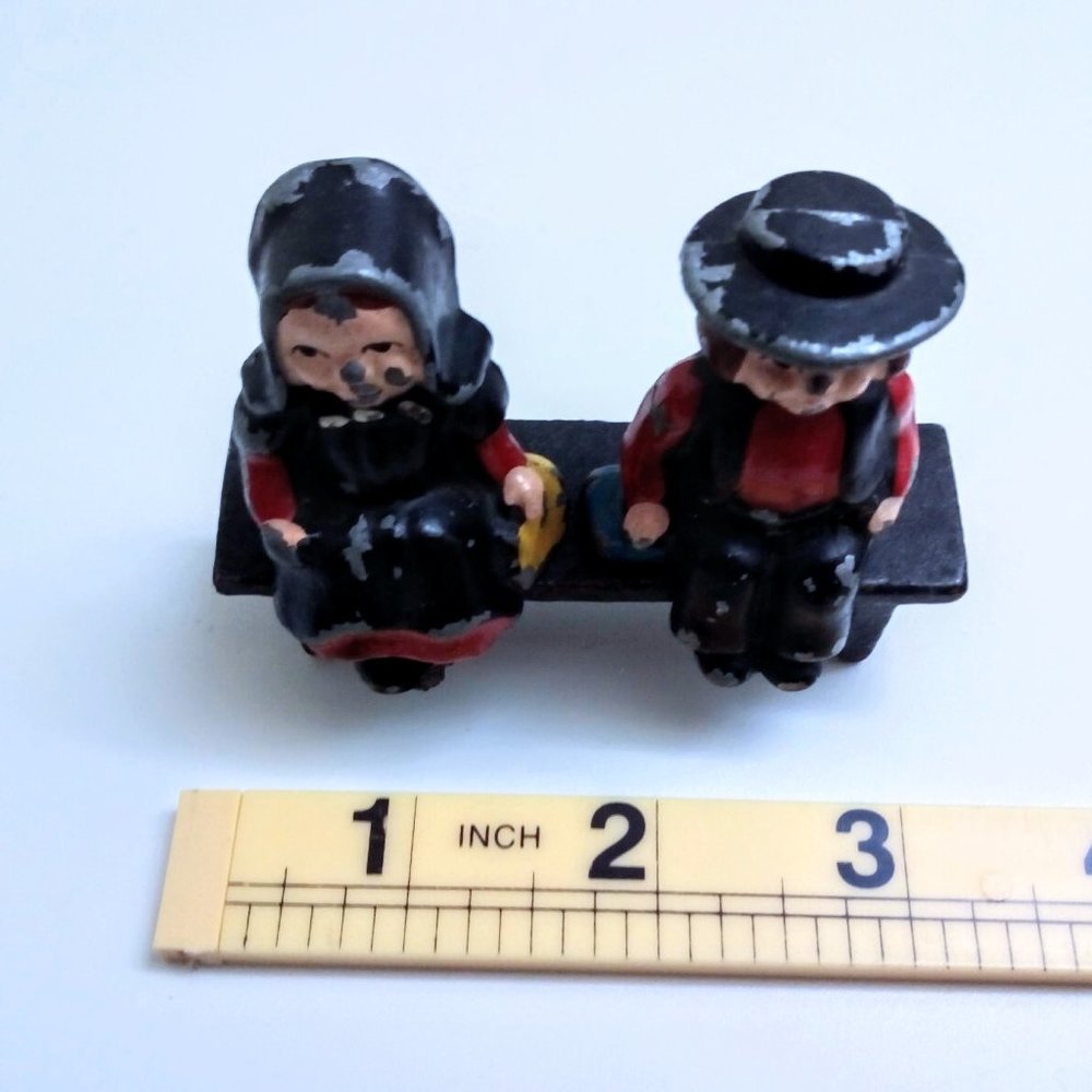 CAST IRON ANTIQUE SALT & PEPPER BOY GIRL SHAKERS